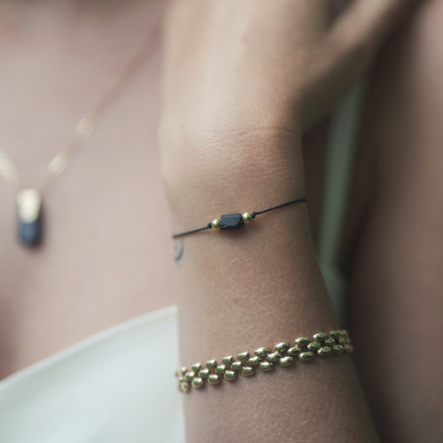 Silk cord bracelet with black tourmaline Le Voyage