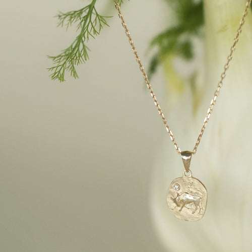 Gold necklace with medallion with the zodiac sign Libra Le Voyage